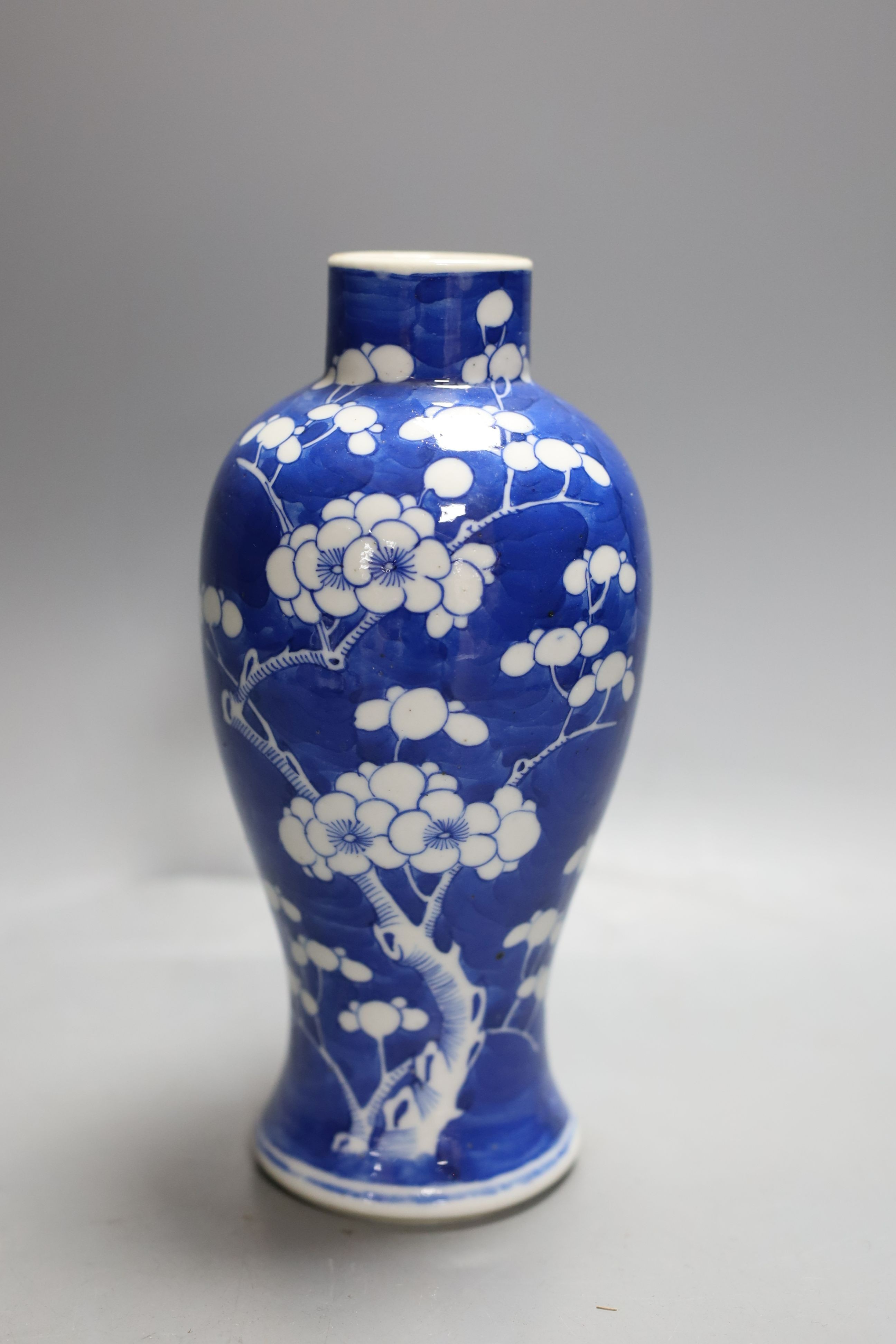 A Chinese blue and white prunus vase, four character mark, height 19cm and two other blue and white items (3)